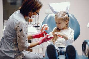 cute-little-girl-sitting-dentist-s-office